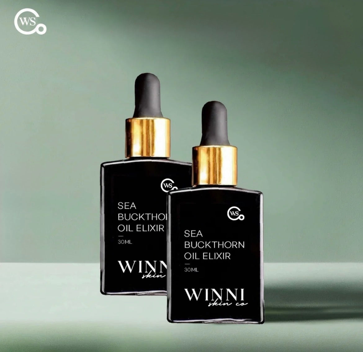 Two Sea Buckthorn Oil Elixir 30ml bottles by Winni Skin Co on sage green background